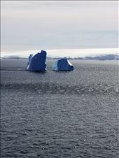 This is actually all one iceberg. The middle is just below water, which is why they're so dangerous.: by suziqtn, Views[202]
