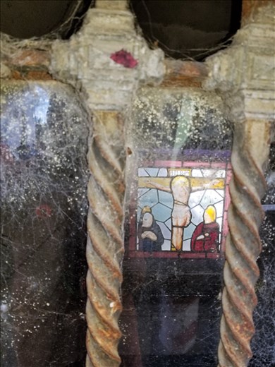 As you look through the windows of the mausoleums, many have stained glass windows.