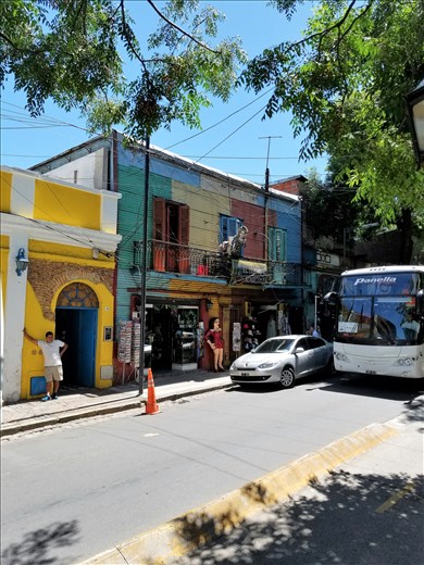 A street scene. Note the statues on the balcony.