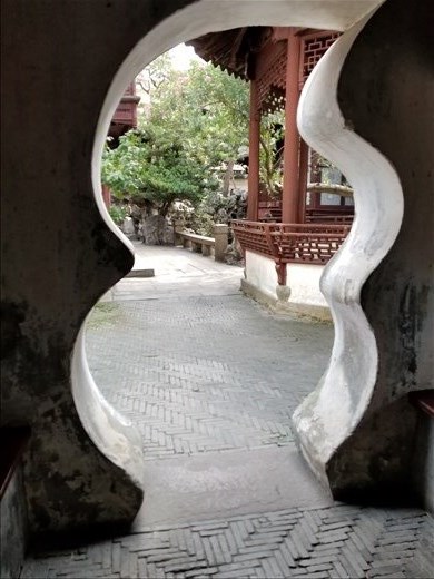 In the gardens, they often constructed decorative gates and reflected the shape of them in the plants you could see when looking through.