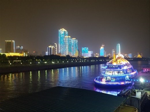 A pleasure craft along the river near 
Shanghai. Note the beautifully lit skyscrapers in the background.