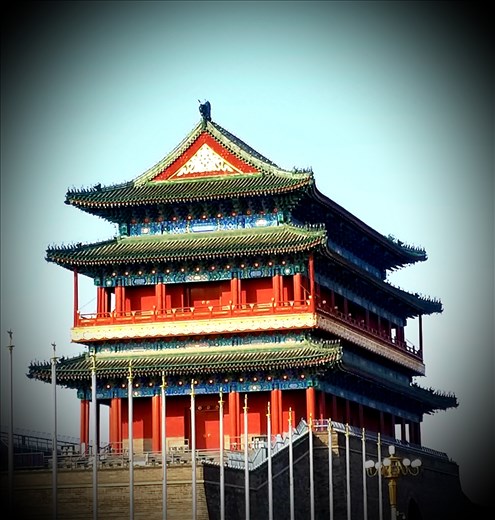A beautiful tower at one corner of the square.