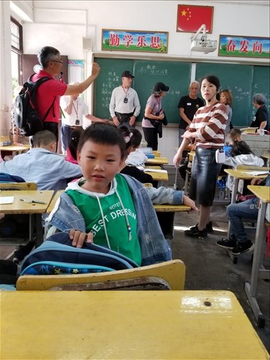 They had me sit at an empty desk behind this boy. He was very interested in me, but didn't speak English, as far as I could tell.