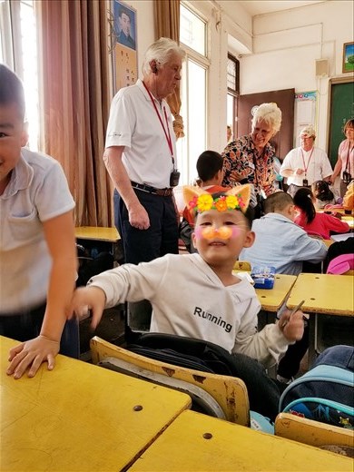 When I showed this boy his photo he started laughing and telling his classmates. Soon they were gathered all around me.