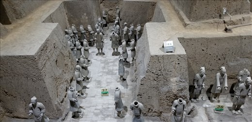 Here is an example of the repair work. Each warrior that is found is numbered and the spot where he was located is also numbered so that on reconstruction, he can be placed back where he was found.