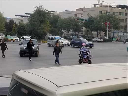 Many people on scooters had these blanket-like things that covered their bodies, heads and hands.