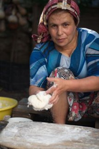 One day a local woman invited me to join her while she's cooking.