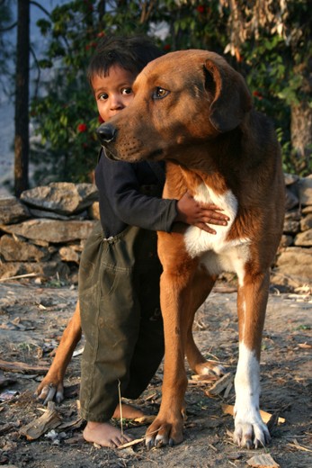 CAPTION: BOY AND THE DOG. LOCATION: DODRA KAWAR, HIMACHAL PRADESH, INDIA. 