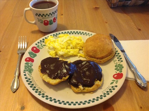 Chocolate gravy served over hot biscuits with scrambled eggs. Southern comfort food!