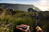 My journal, my camera, and serenity; ingredients for a happy me.  I wrote an unfinished poem up there (as a lot of them end up to be).  That's Table Mountain in the distance, and I'm laying on top of Devil's Peak.  It was really windy, so I found a little grassy nook in between some rocks, and just enjoyed the view. : by sweetsolace, Views[513]