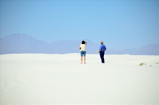 A couple admiring the beauty of the White Sands National Monument in NM, USA.