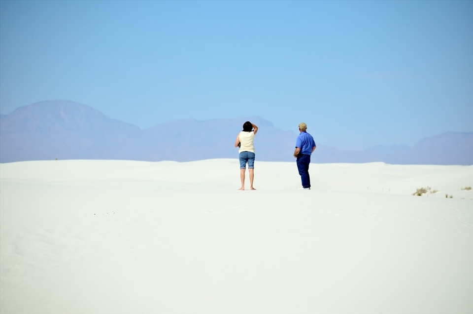 A couple admiring the beauty of the White Sands National Monument in NM, USA.
