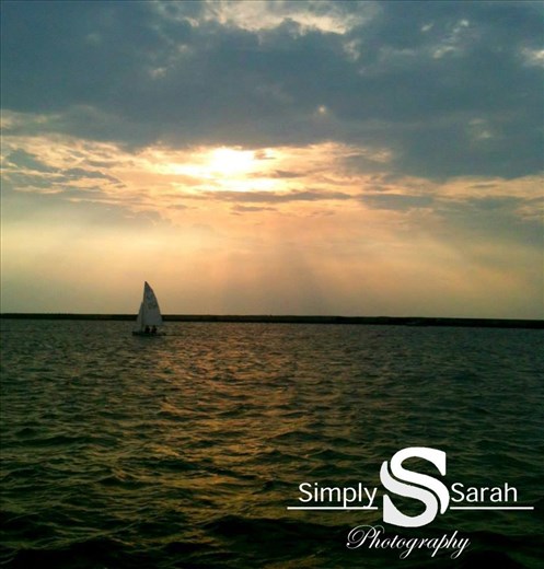 a boat on Lake Erie with a nice sun set
