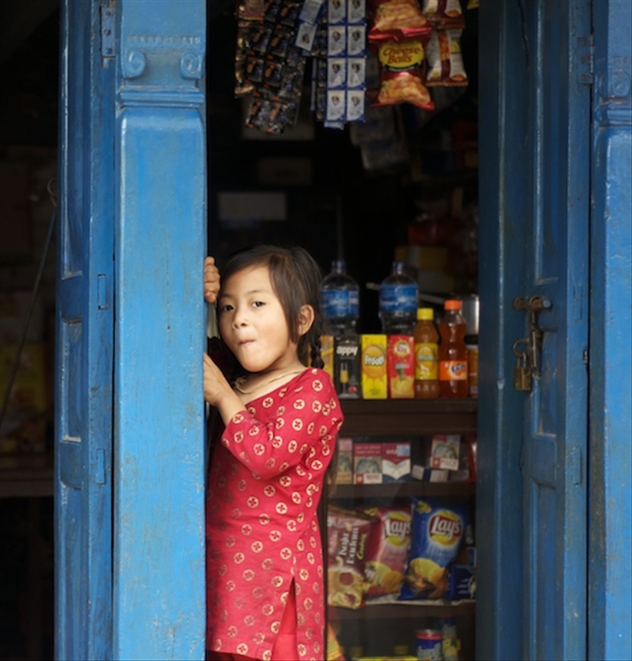 The Tharu tribe is a tribe native to the plains of Chitwan. In today’s times this tribe has been reduced to a group of landless farmers living in extreme poverty. Oblivious to her family’s financial condition, little Anita giggles away as she poses for the camera.