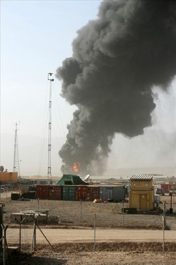 At a vehicle depot outside of the main base, a fuel tanker erupts in a massive ball of flame, sending thick black smoke across the sky. Whilst the explosion is believed to have been cause by an improvised explosive device (IED), it was more than likely a power struggle between two transport companies as opposed to an attack on coalition forces. 
