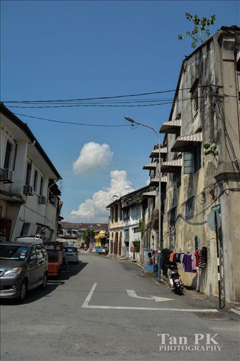 The backstreet of the Penang Georgetown buildings. It was a sunny day!Some of the residents were drying their clothes.It was a peaceful Sunday.