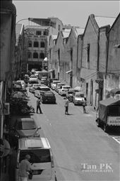 Every time when I looked down the street,it gives me a feeling like back to 40's.It was Saturday, many tourist and cars came across the street.I choose to snap this photo when there was less people and cars pass by.Still, it can't gives a satisfaction until i changed it to black and white.Imagine the old time ,the street might be look like this.: by tanpoikah, Views[264]