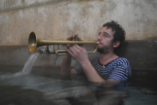 Balkan bath with striped trumpet player