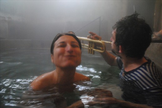 Balkan bath with striped trumpet player and happy girl