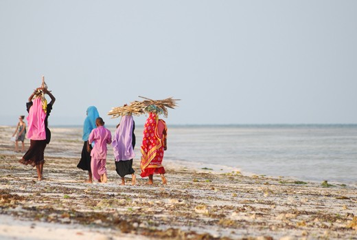 Young African children in their colorful clothes in the Muslim town of Jambiani