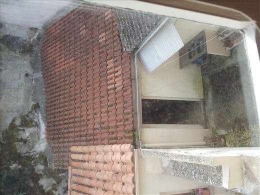 A enclosed courtyard in another house 