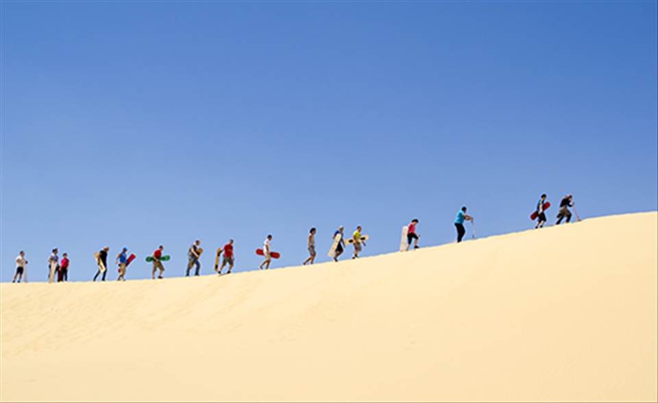 Doing some sand boarding