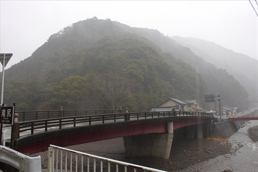Kii Tanabe, the start of our Kumano Kodo pilgrimage- absolutely hammering down with rain and yes- we are about to climb over that mountain in the background