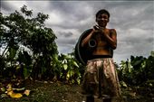 Boss Boy.

The eldest son participates in the unideal work conditions, chasing buckets of water for the younger children to bathe in. This photo represents his teenage boy forms, posing playfully for the camera. This pose is common amongst young Manila adolescents.: by tashsorensen, Views[652]