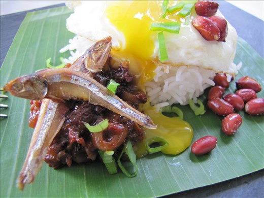 I serve my Nasi Lemak with a sunny side up fried egg. The runny yolk runs into the sambal... yum!