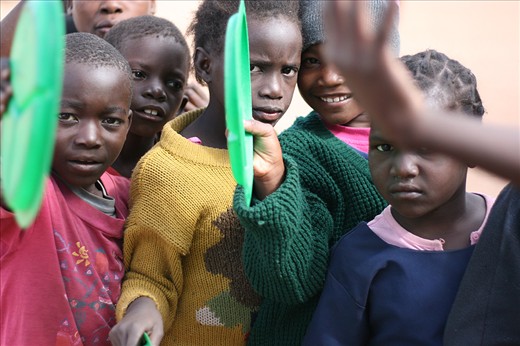 Waiting in line for a meal. Without school, these kids will starve.