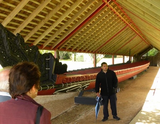 Waitangi Treaty Grounds - Guide with Waka (war canoe)