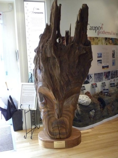 Since the carvings in the whare couldn't be photographed, here's the one outside that could. It's not completely traditional, but it is a creative use of the tree from which it is carved.