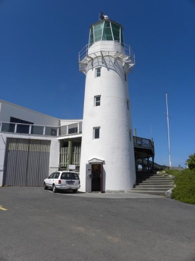 This is the replica lighthouse, built and maintained by the Cape Egmont Boat Club. When the original lighthouse was automated, they wanted to save the original lens, so they built a replica lighthouse and mounted the lens in here. They also turned it into a museum.