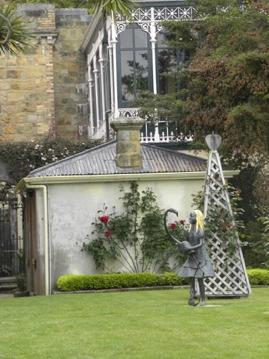 Alice is still trying to wrangle her golf club! Unfortunately, we never found the Cheshire Cat. We searched the internet for a clue later. We forgot to look up, he was up in a tree!