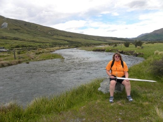 Anna waits her turn to cross the swinging bridge. Do you like her walking stick?