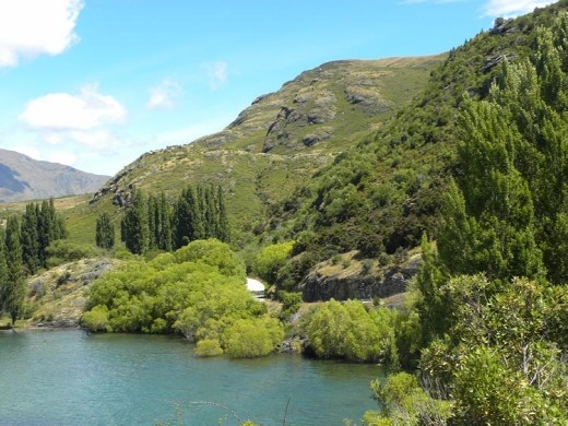 Green rolling hills as the road wound around the bay.