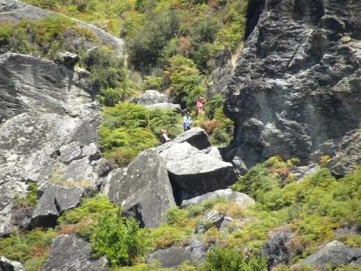 Look closely for the guys at the bottom. Don't let go of that rope!