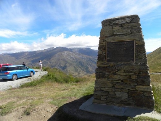 Anna is checking out the view from the Crown Range Summit. Look at our bright blue station wagon!