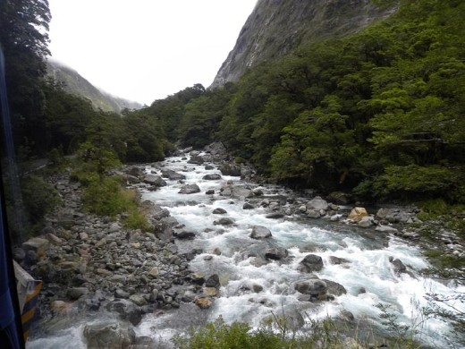 Monkey Creek rushes alongside the winding road.