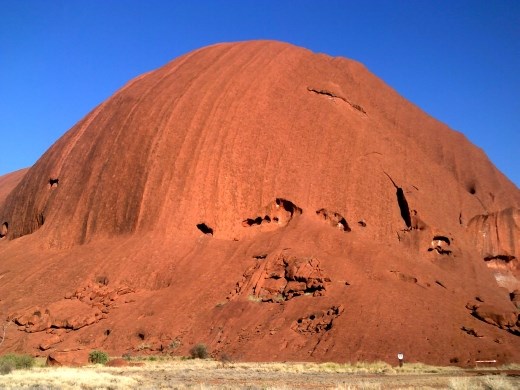 The west end of Uluru at the Kuniya Pit is nearly round with several pockmarks.