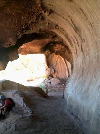 This is a women's place, no men were allowed here. They taught the young girls the secrets of becoming a woman. You can see places where they would grind seeds on the flat spots.