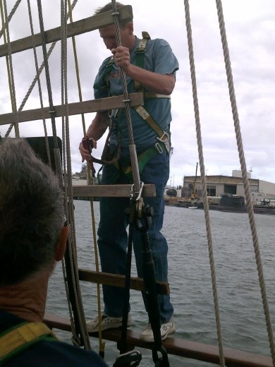 Kent clips his ascender on to the ropes and starts his climb up the mast...