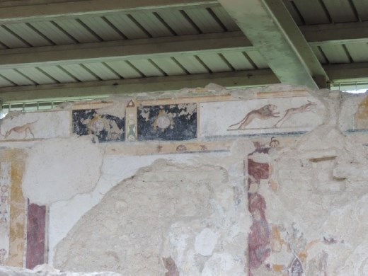 The frescoes told the tales of Roman conquests.