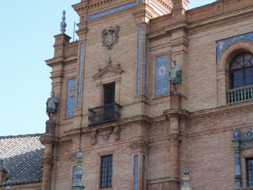 Statues stand guard above the central towers.