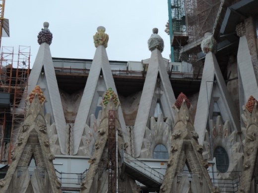 Details, details, details. And more details! A springtime fruit cluster atop the eastern towers.
