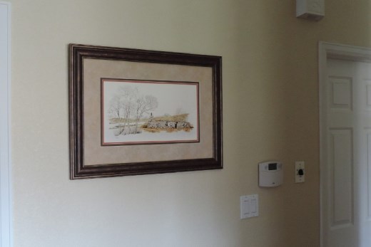 We fell in love with Bill Lawrence, who drew these landscape scenes showing the rugged beauty on the northern half of the Isle of Skye. This piece depicts the Trotternish Ridge that bisects the north of Skye. It also shows a crofters cottage next to a weathered tree. We enjoyed talking with Bill and his wife (Sue).