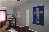 The third wall of art in our Master Bedroom shows a large Celtic cross on a cotton wall hanging (purchased on the Isle of Skye, Scotland) and a beachy print from Cairns, Australia (near the Great Barrier Reef). You can just see the edge of the sitting area on the far left of this photo.: by taylortreks, Views[296]