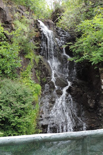 Pretty-Waterfall-Provides-a-Centerpiece-of-the-Water-Garden