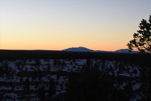 Looking south from the Powell Viewpoint to the San Francisco Peaks bathed in the first light of a new day.
