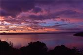 Fiery clouds are reflected in the still waters of Lake Taupo.: by taylortreks, Views[237]